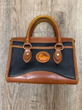 Dooney & Bourke Black Pebbled Leather Satchel with Brown Trim